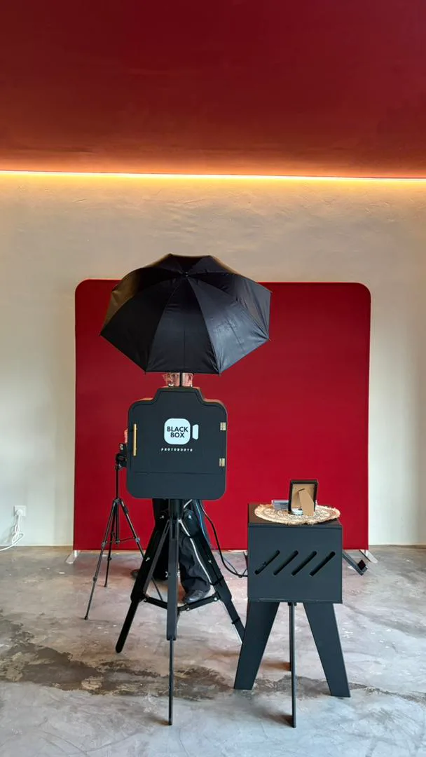 BlackBox Photobooth setup with lighting and red backdrop